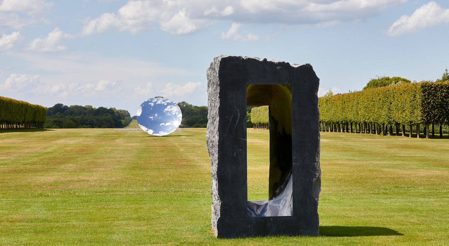 Untitled, 1997, Kilkenny limestone. Courtesy the artist. Sky Mirror, 2018, stainless steel. Courtesy the artist and Lisson Gallery. © Anish Kapoor. All rights reserved DACS, 2020 Photo: Pete Huggins